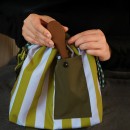 Handheld and crossbody insulated bag