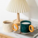Ceramic cup with a heart - shaped handle