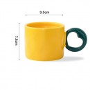 Ceramic cup with a heart - shaped handle